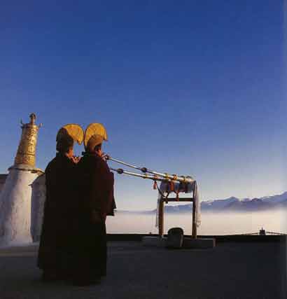 
Monks at dawn on the roof of Nechung Monastery - Illustrated Teachings of the Dalai Lama book
